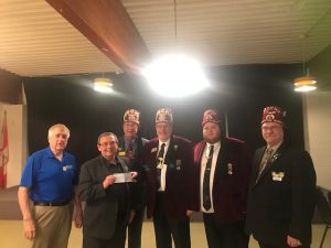 Moramos Shriners Club of Windsor presenting a cheque to Riverside Miracle Park.